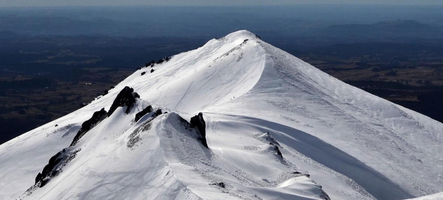 Super Besse: Panoramic View of Snow-Capped Peaks, A Magical Landscape