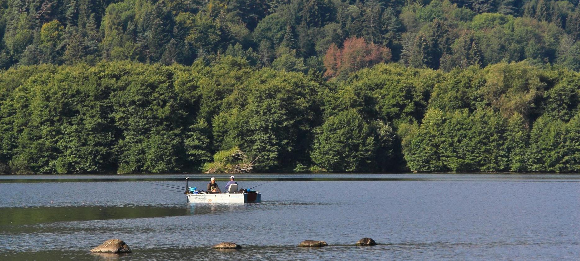 Lake Chambon: Fishermen in boats on the lake