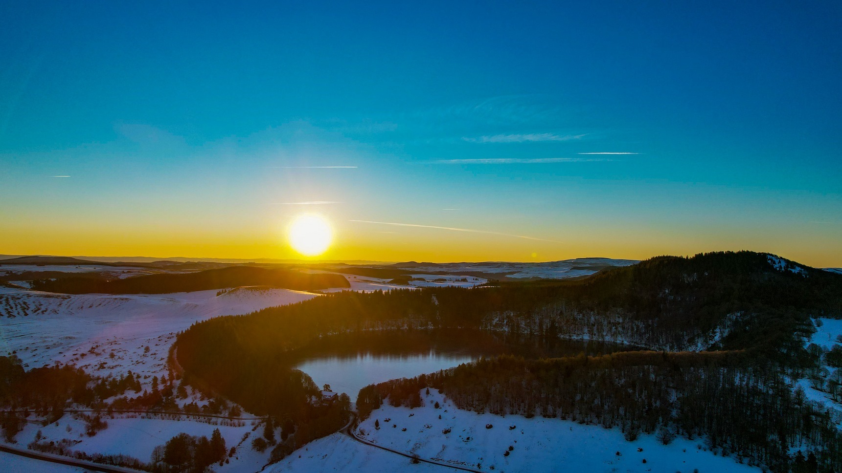 Dazzling Sunrise: Lake Pavin and Puy de Montchal in Harmony