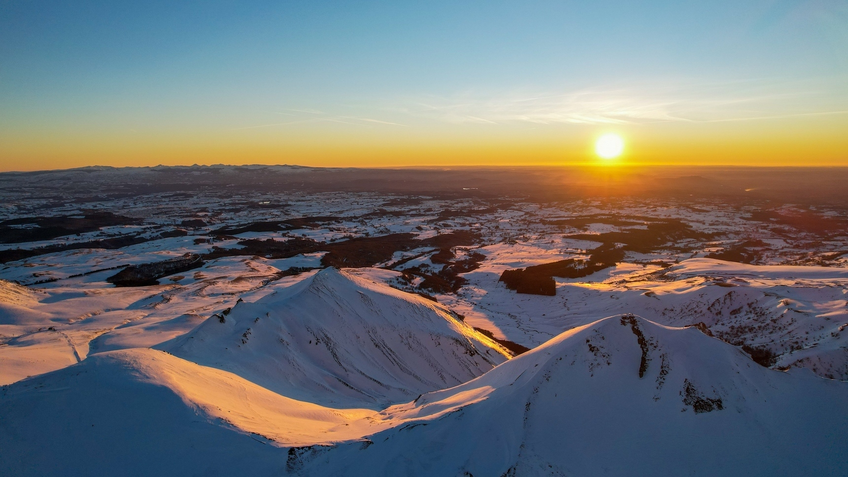 Snowy Puy de Sancy: Magical Sunset over the Massif