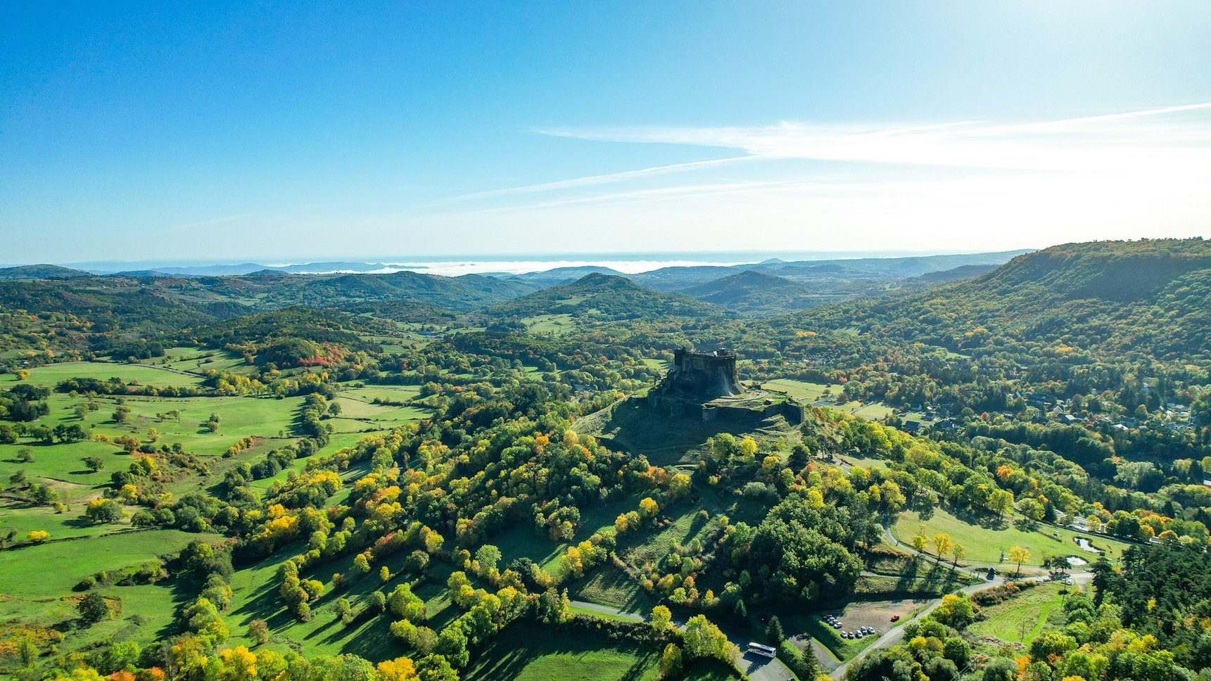 Murol Castle, perched on its rocky promontory, dominates the Auvergne countryside.