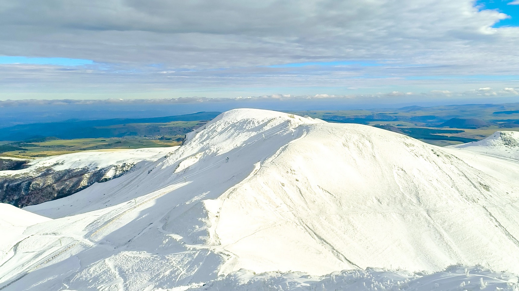 Sancy Massif: Le Puy Ferrand under a veil of snow in November.