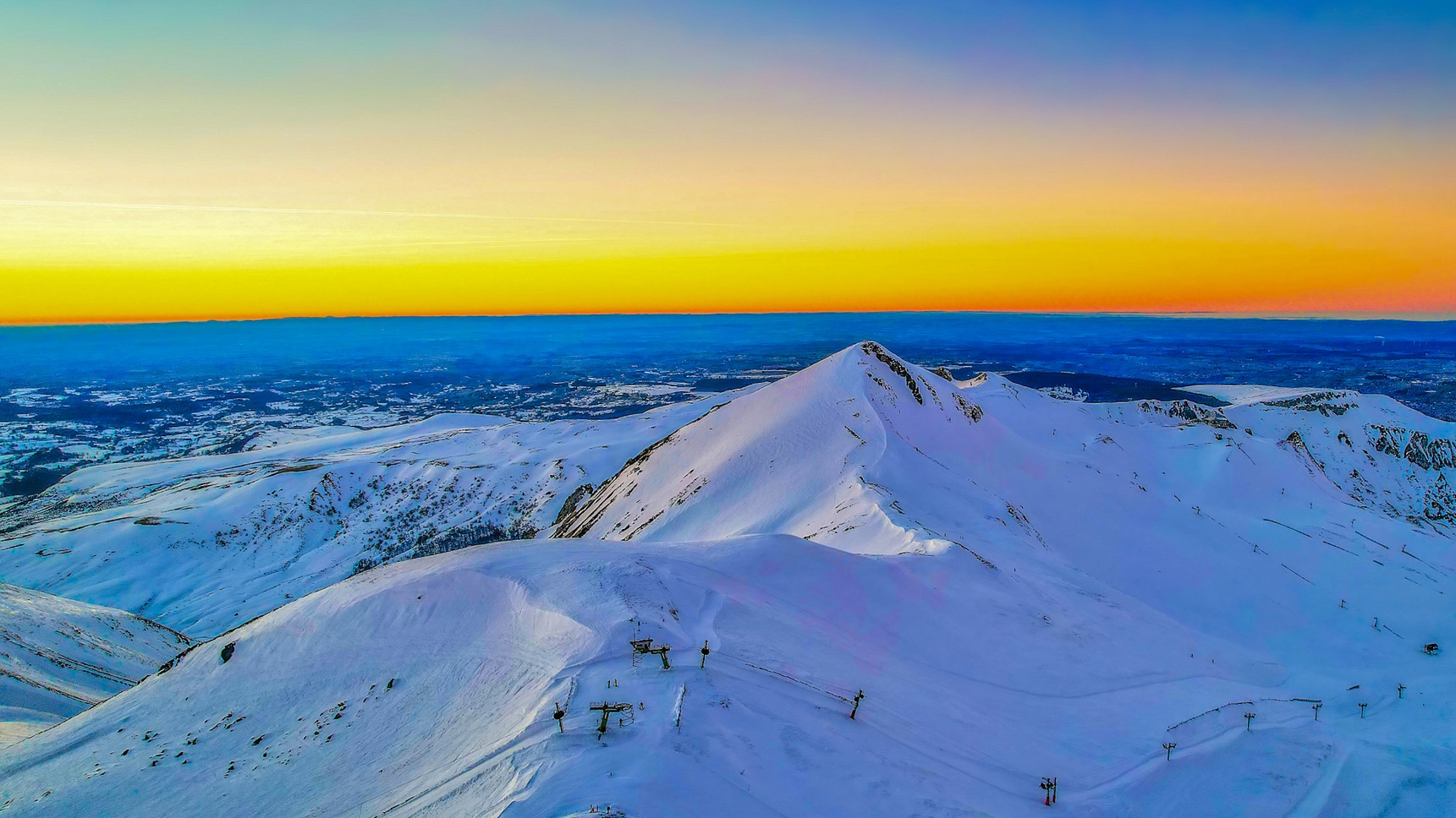 Summit of Puy Ferrand: Breathtaking view of the Puy de Sancy at sunset