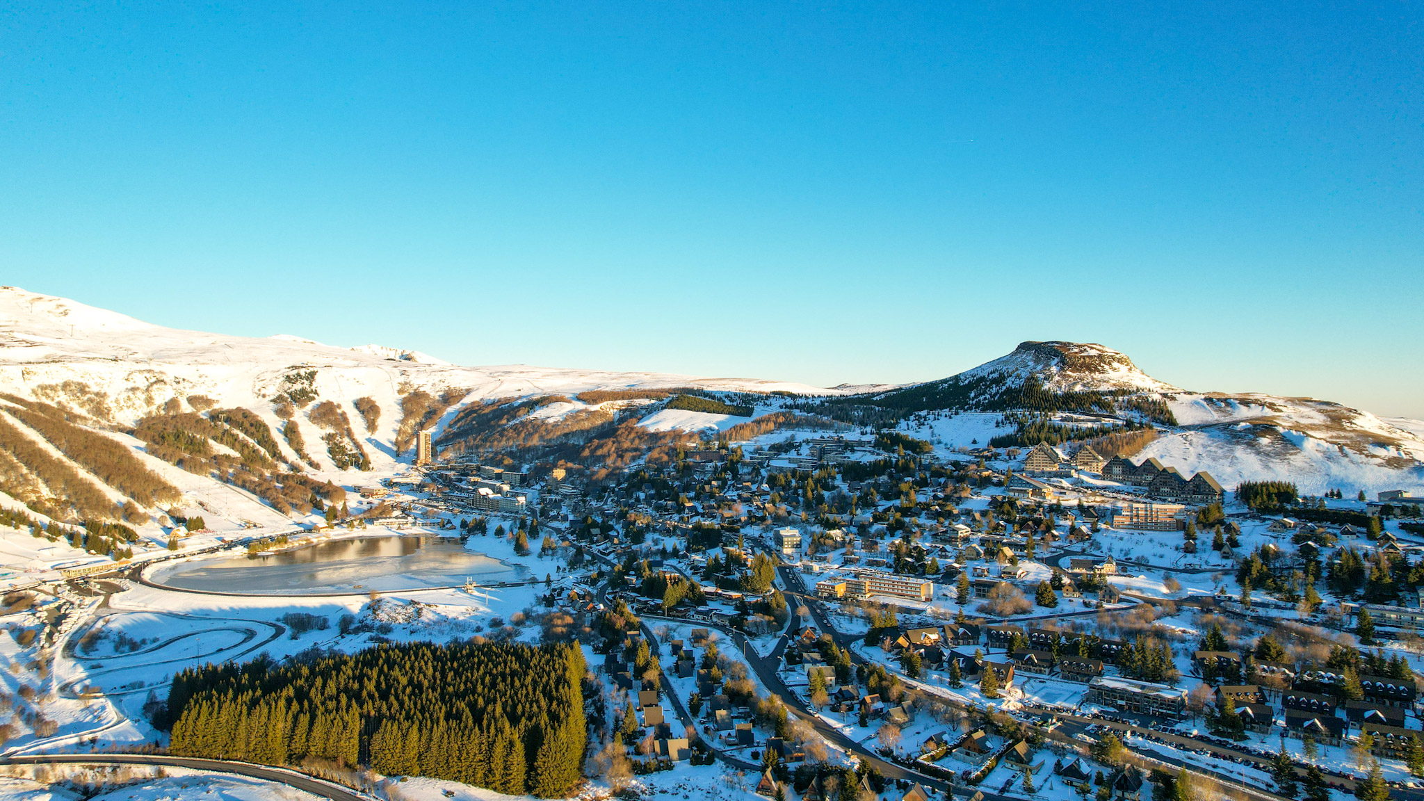 Super Besse: Magical Sunrise over Lac des Hermines and the City Center