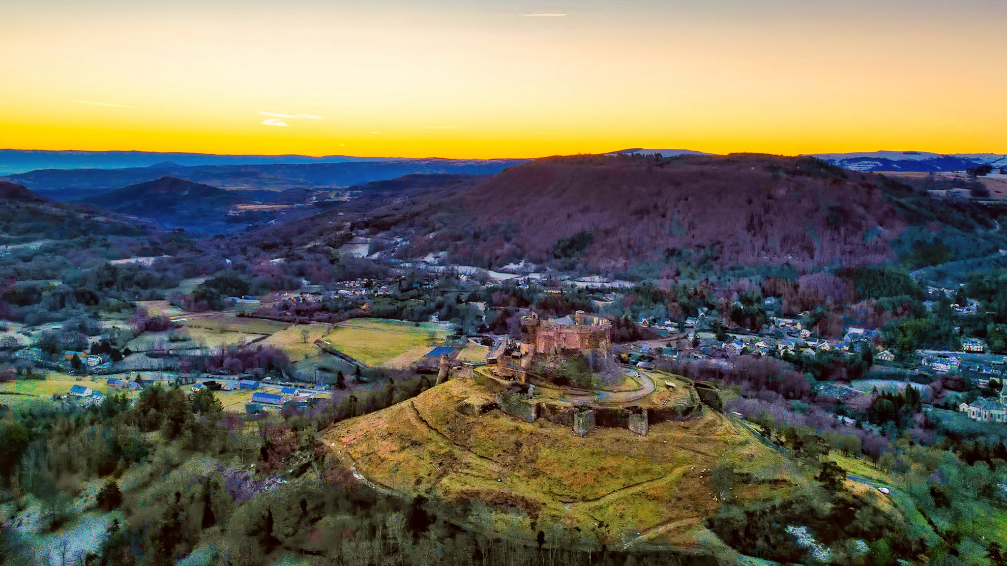 Massif du Sancy: Murol Castle, illuminated by the first rays of the sun.