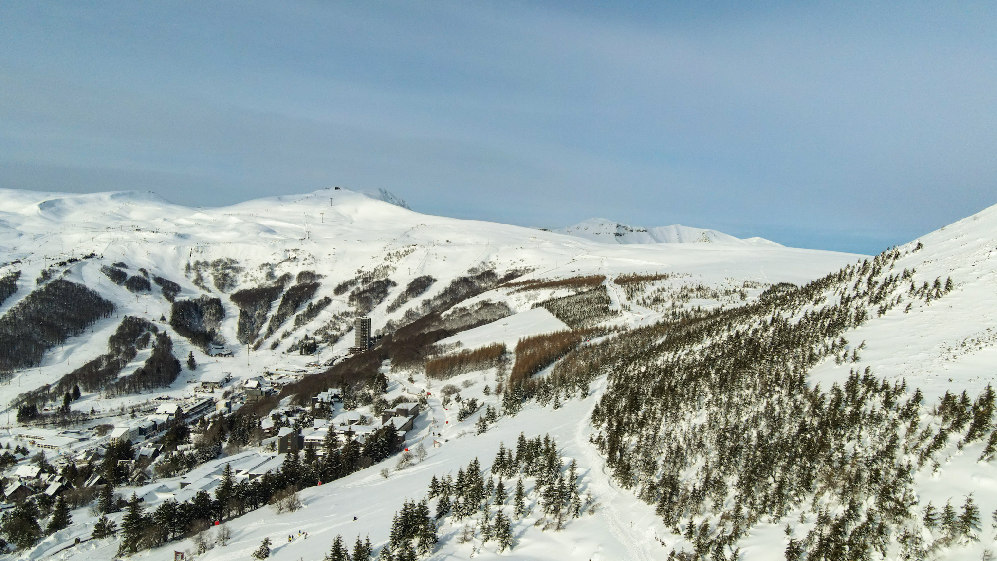 Super Besse: Snow-covered ski slopes, magical aerial view