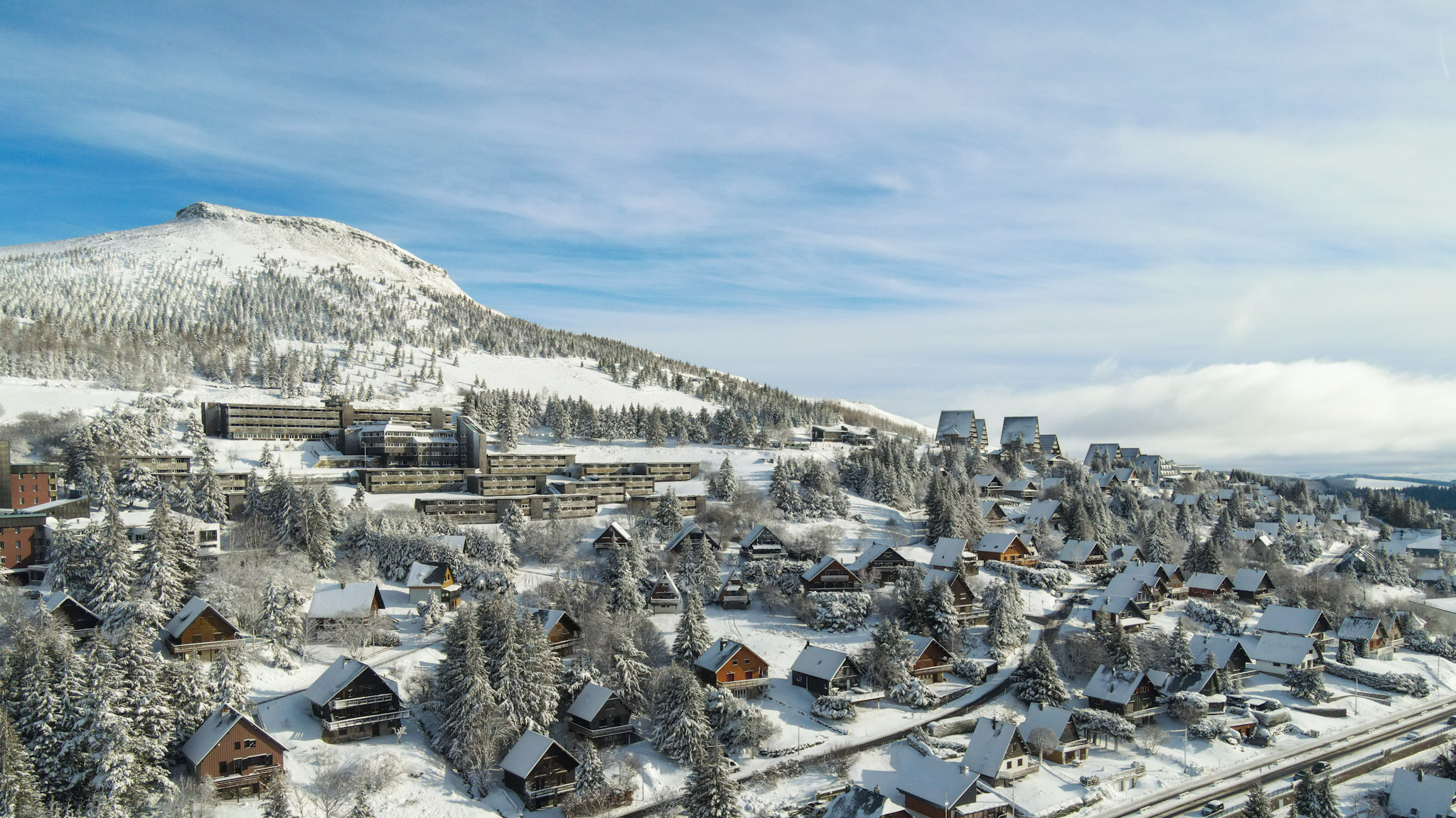 Super Besse - Winter Wonderland: Puy du Chambourguet and Snowy Village, Aerial View