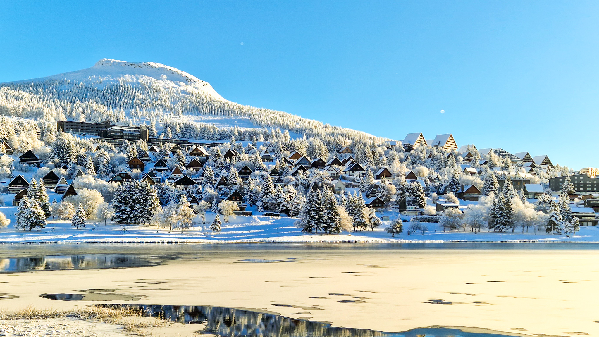 Super Besse: Village of Chalets Illuminated by the Rising Sun