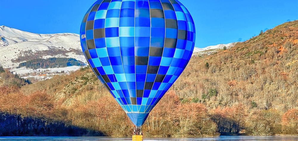Lake Chambon: A magical spectacle, a hot air balloon placed on the lake.