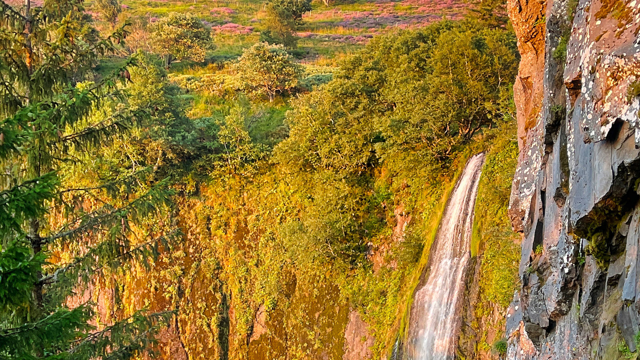 The Great Cascade of Mont Dore: A Spectacle of Light and Colors at Sunset