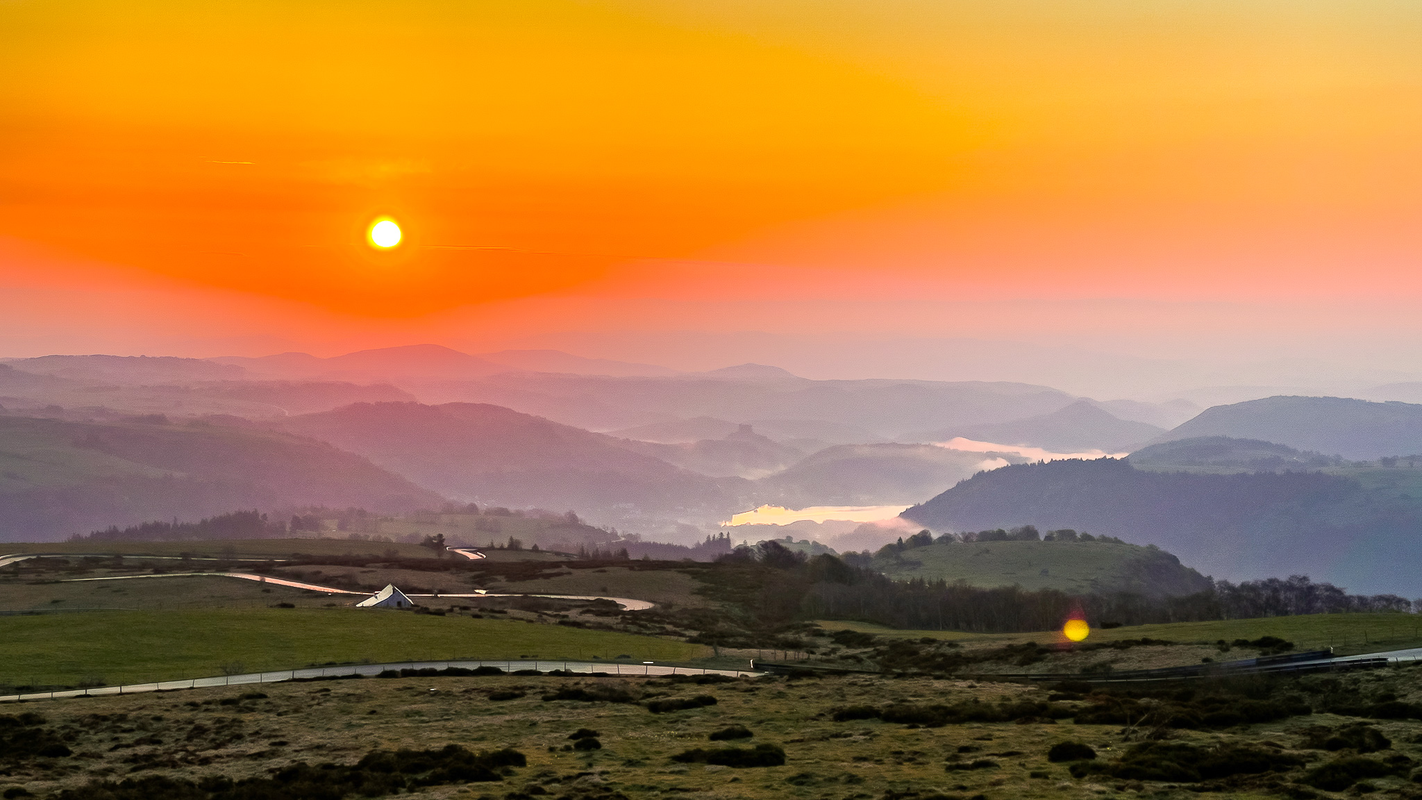 Mont Dore: Magical Sunrise over Lake Chambon and the Château de Murol