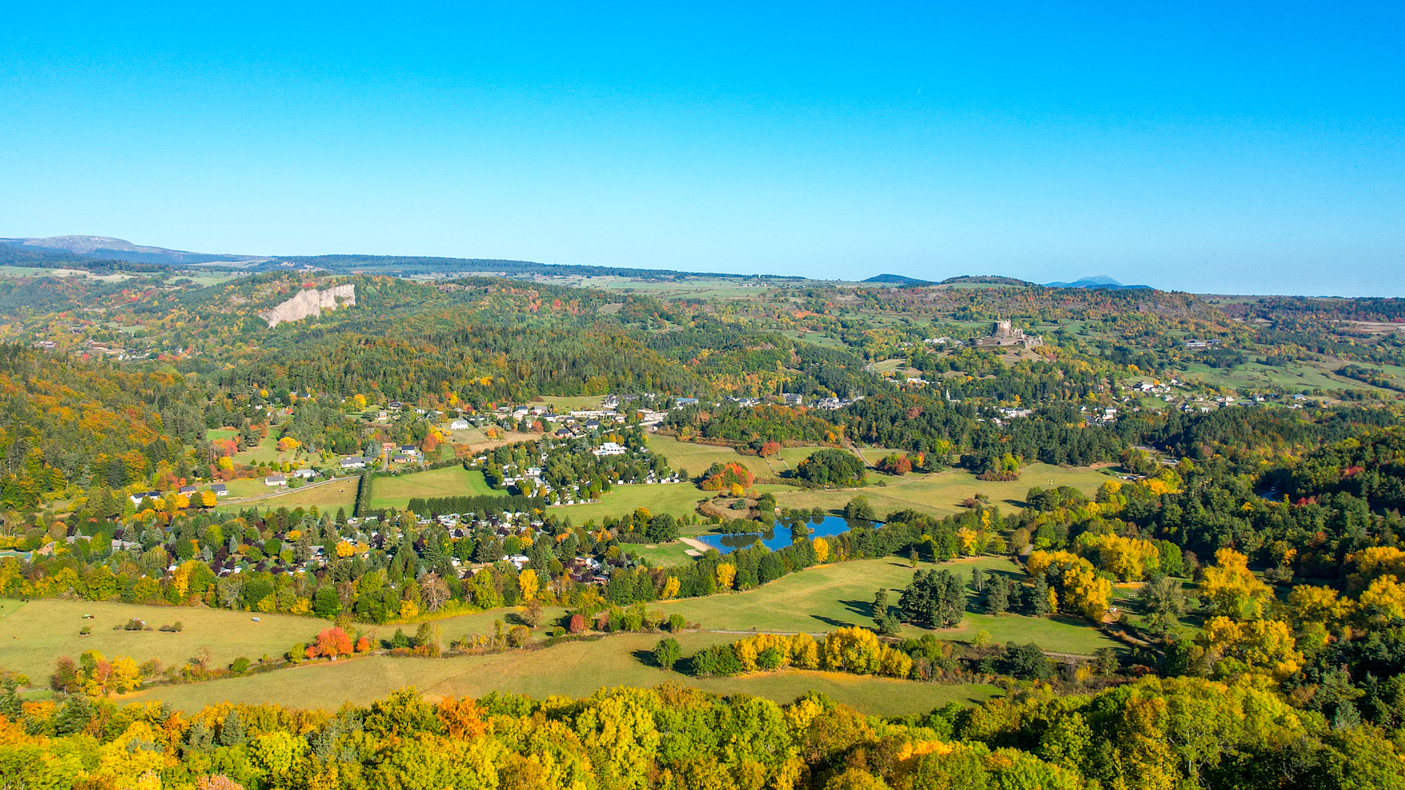 Murol: A village at the foot of a majestic castle.